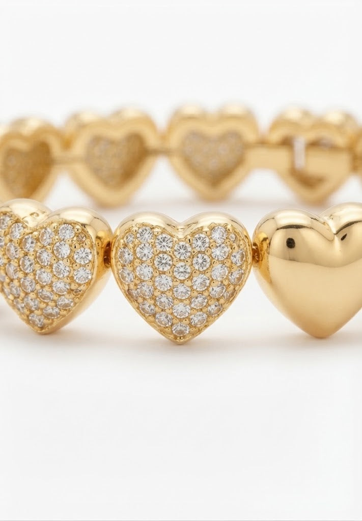 Gold-plated bracelet with heart charms - close-up detail
